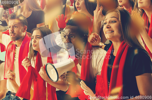 Image of Group of happy fans are cheering for their team victory.