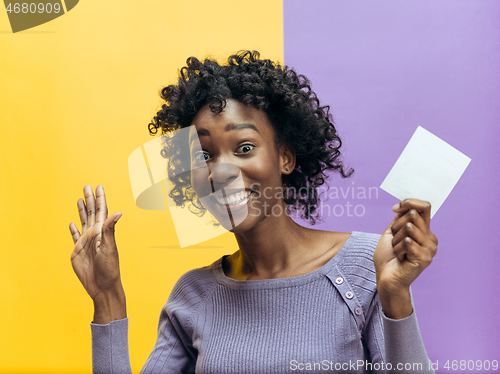 Image of Young woman with a surprised expression won a bet