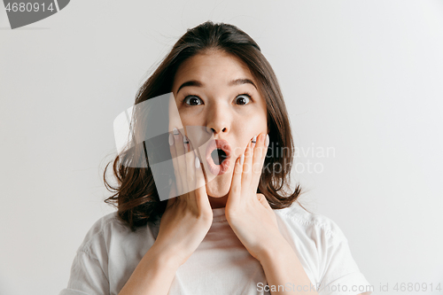 Image of Beautiful woman looking suprised