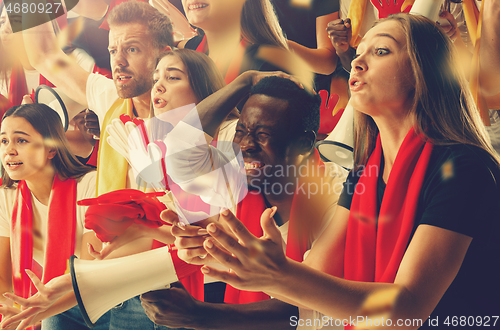 Image of Group of happy fans are cheering for their team victory.