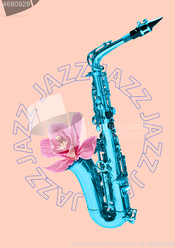 Image of Blue saxophone on pink background