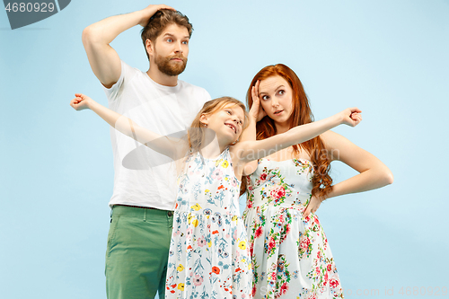 Image of Happy parent with daughter at studio isolated on blue background