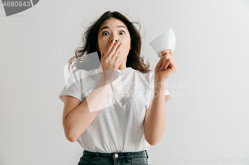 Image of Young woman with a surprised expression won a bet