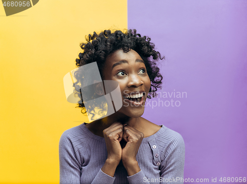 Image of Winning success woman happy ecstatic celebrating being a winner. Dynamic energetic image of female afro model