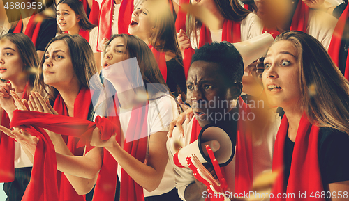 Image of Group of happy fans are cheering for their team victory.