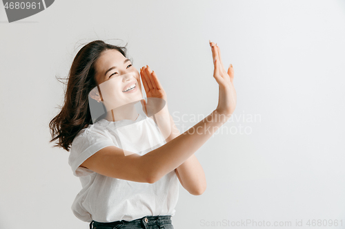 Image of Isolated on pink young casual woman shouting at studio