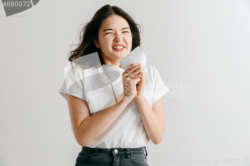 Image of Young woman with a surprised expression won a bet