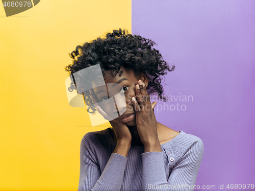 Image of The serious business woman standing and looking at camera