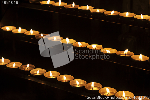 Image of Burning candles in a church