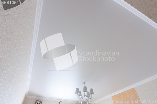 Image of White matte ceiling in a large room close up