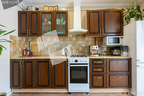 Image of Kitchen set for dark wood in a standard apartment