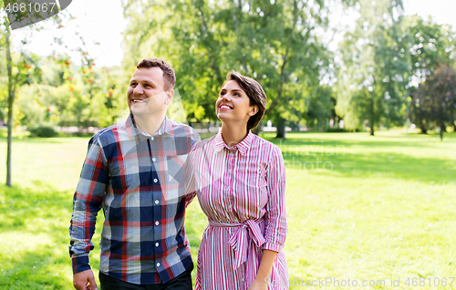 Image of happy couple in summer park