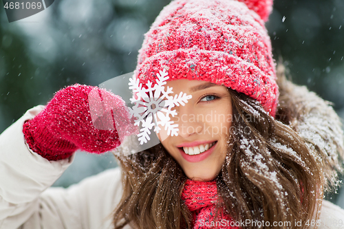 Image of portrait of teenage girl with snowflake in winter