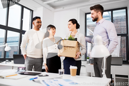 Image of new female employee meeting colleagues at office