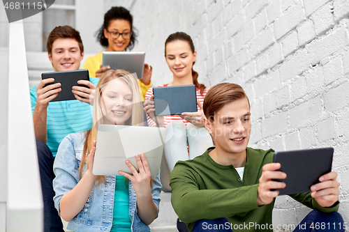 Image of high school students with tablet computers