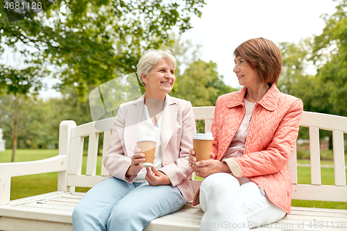 Image of senior women or friends drinking coffee at park