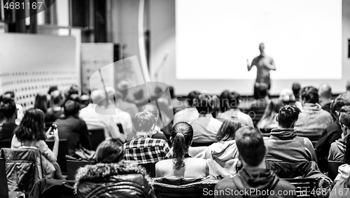 Image of Business speaker giving a talk at business conference event.