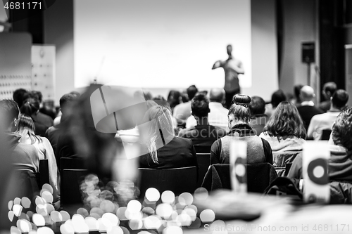 Image of Business speaker giving a talk at business conference event.