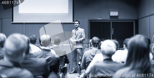 Image of Business speaker giving a talk at business conference meeting event.