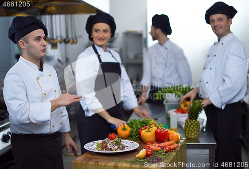 Image of team cooks and chefs preparing meals