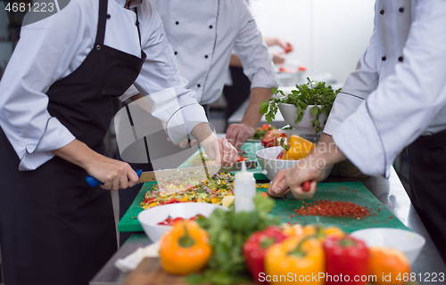 Image of team cooks and chefs preparing meals