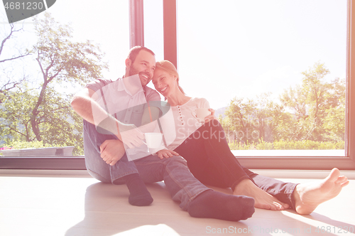 Image of romantic couple enjoying morning coffee