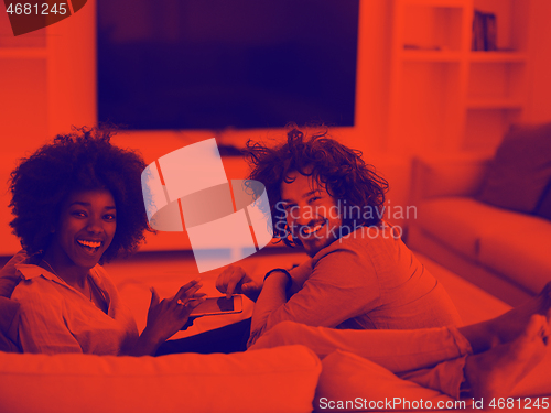 Image of multiethnic couple in living room