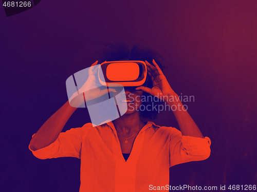 Image of black girl using VR headset isolated on gray background