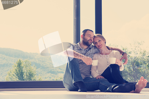 Image of romantic couple enjoying morning coffee