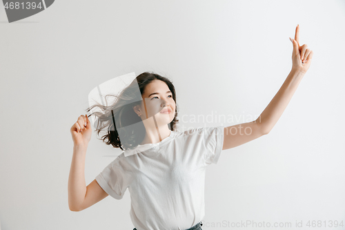 Image of Winning success woman happy ecstatic celebrating being a winner.