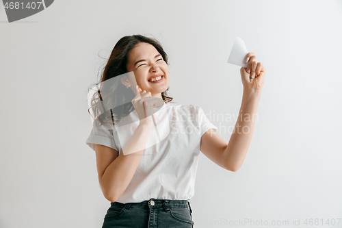 Image of Young woman with a surprised expression won a bet