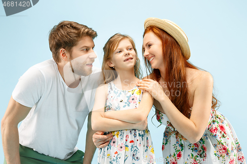 Image of Happy parent with daughter at studio isolated on blue background