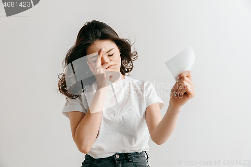 Image of Young woman with a sad expression lost a bet