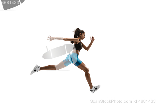 Image of Young african woman running or jogging isolated on white studio background.