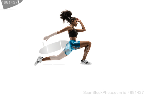 Image of Young african woman running or jogging isolated on white studio background.