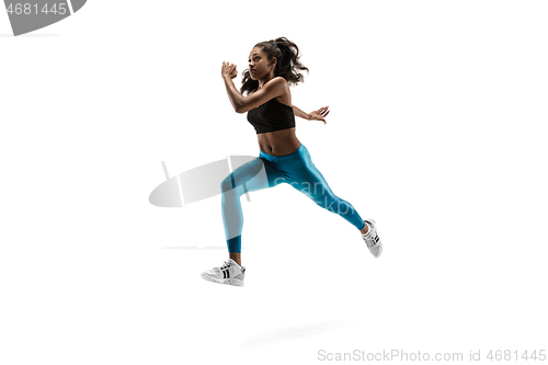 Image of Young african woman running or jogging isolated on white studio background.