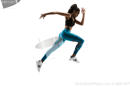 Image of Young african woman running or jogging isolated on white studio background.