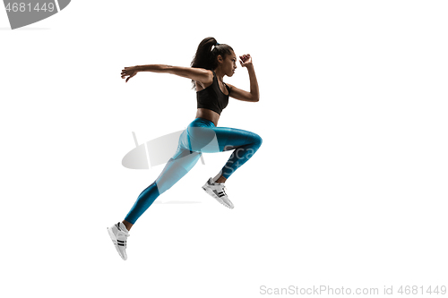 Image of Young african woman running or jogging isolated on white studio background.