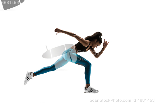 Image of Young african woman running or jogging isolated on white studio background.