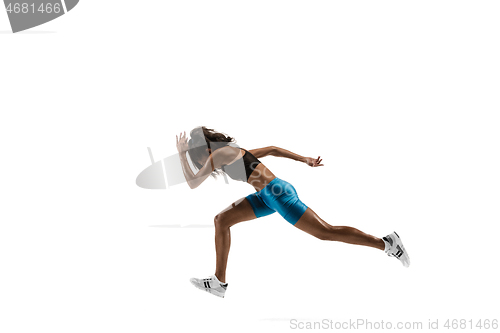 Image of Young african woman running or jogging isolated on white studio background.