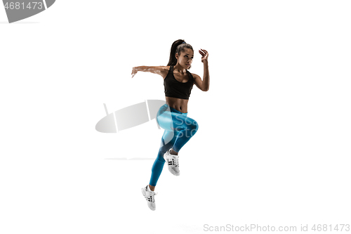 Image of Young african woman running or jogging isolated on white studio background.