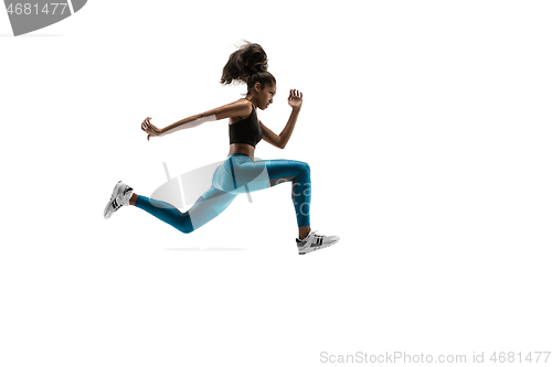 Image of Young african woman running or jogging isolated on white studio background.