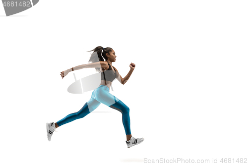 Image of Young african woman running or jogging isolated on white studio background.