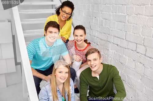 Image of teenage friends or students hanging out on stairs