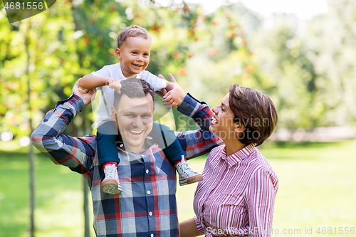Image of happy family having fun at summer park