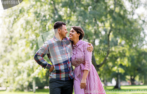 Image of happy couple in summer park