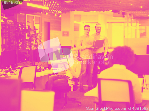 Image of businessman working using a laptop in startup office