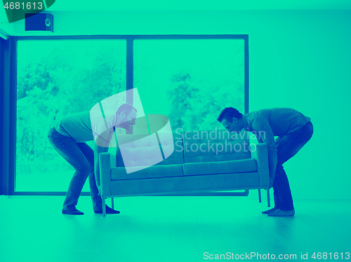 Image of men carry the sofa