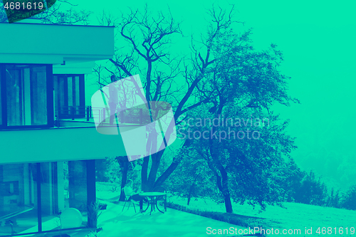 Image of man drinking morning coffee on balcony