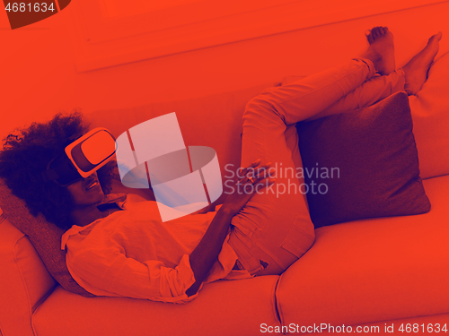 Image of black woman using VR headset glasses of virtual reality